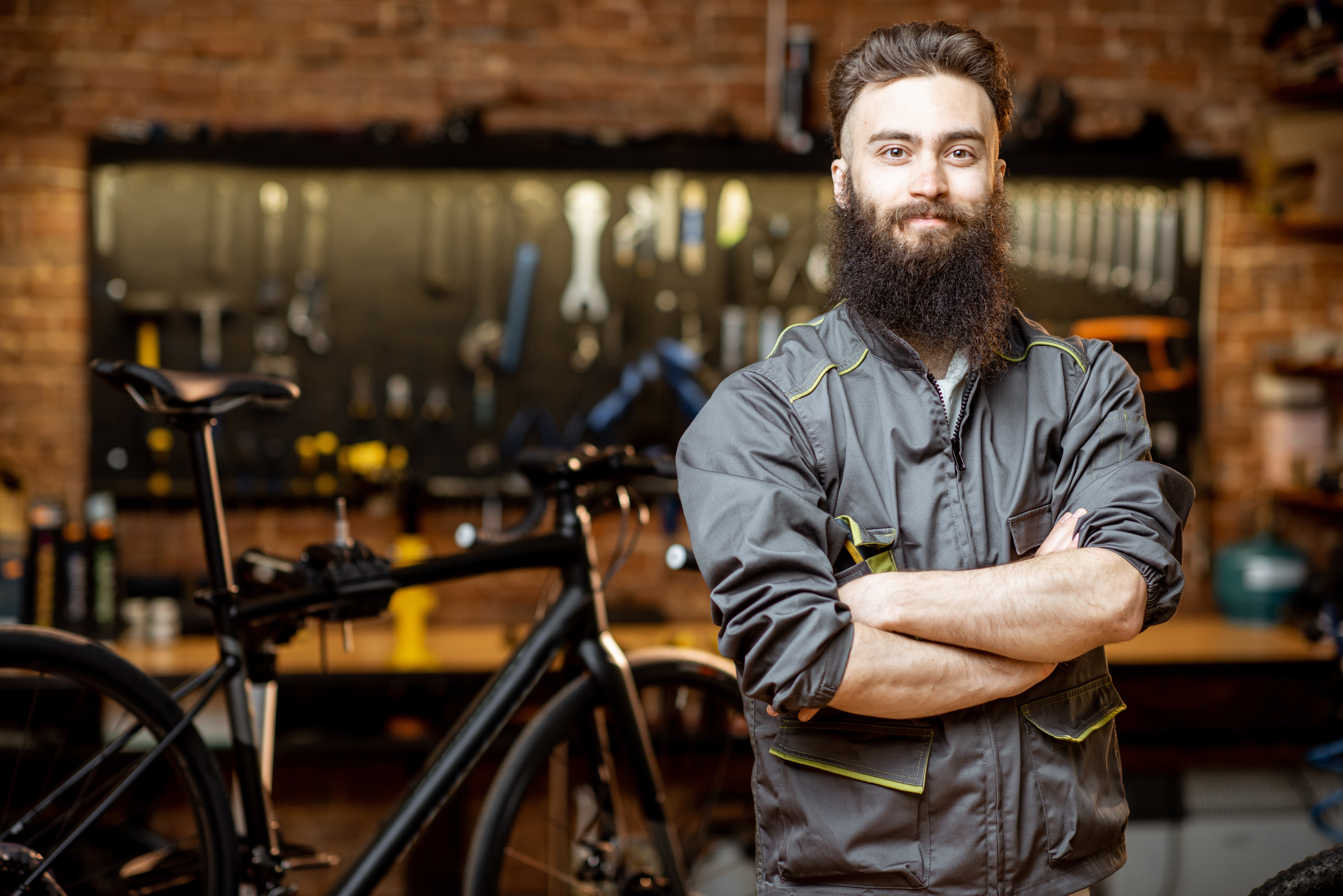 Man standing in bicicle workshop